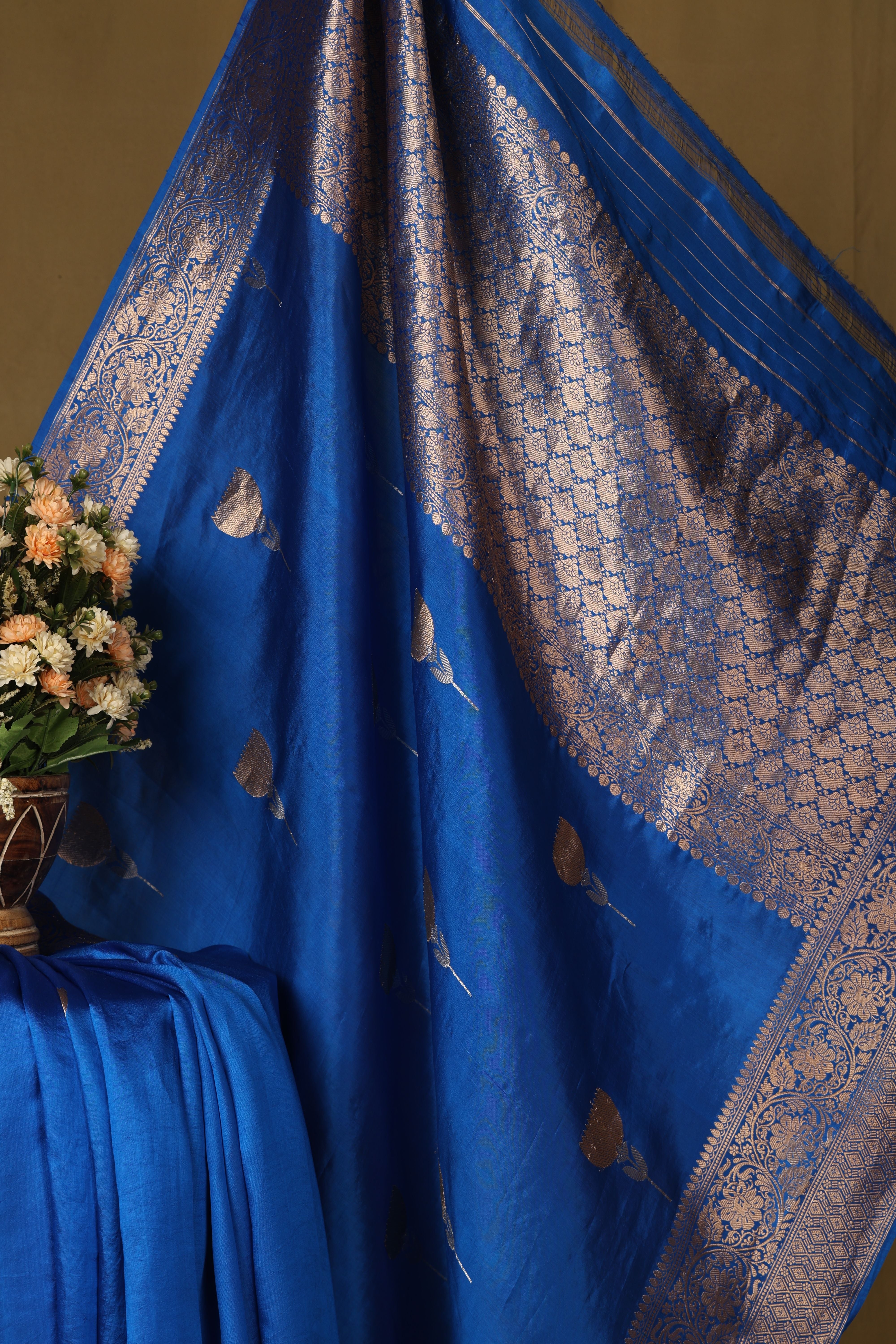Banarasi pure silk blue handloom saree with intricate zari bute all over and intricate border