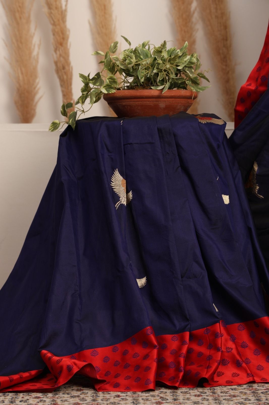 Banarasi pure silk ink blue handloom saree with zari Bute all over and a contrast border and pallu